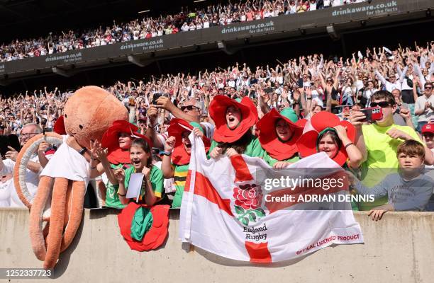 England's fans celebrate as their team wins the Women's Six Nations Grand Slam at the end of the Six Nations international women's rugby union match...