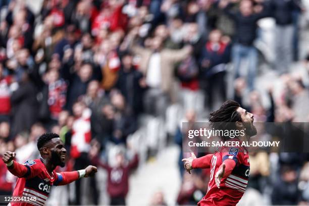 Lille's Portuguese midfielder Andre Gomes celebrates scoring his team's first goal during the French L1 football match between Lille LOSC and AC...