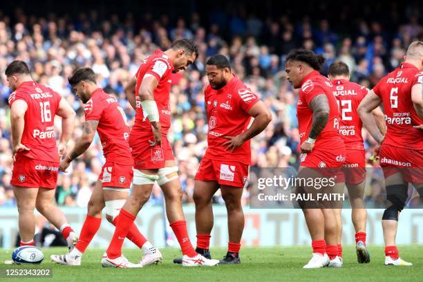 Toulouse's players react as they slip to defeat late in the game during the European Champions Cup semi-final rugby union match between Leinster and...