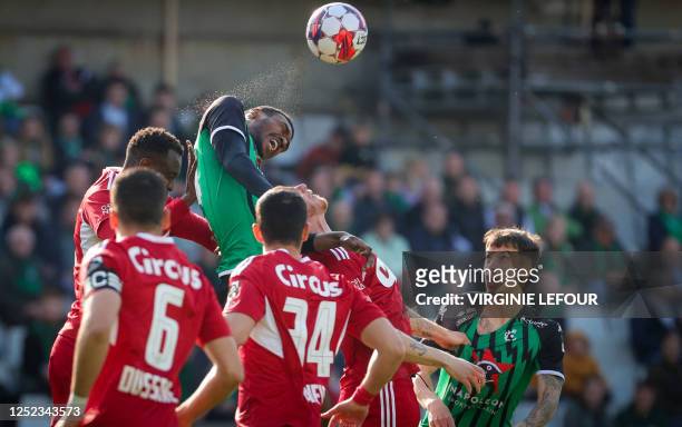 Standard's Congolese midfielder Merveille Bope Bokadi and Cercle's French defender Jean Harisson Marcelin fight for the ball during a soccer match...
