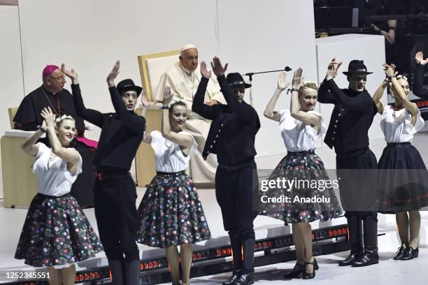 April 29: Pope Francis watches a dance performance as he meets with young people at Papp Laszlo Sportarena during his visit in Budapest, Hungary,...