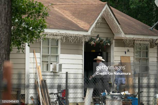 Law enforcement respond to a crime scene where five people, including an 8-year-old child, were killed after a shooting inside a home on April 29,...