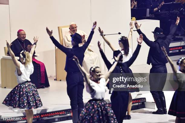 April 29: Pope Francis watches a dance performance as he meets with young people at Papp Laszlo Sportarena during his visit in Budapest, Hungary,...