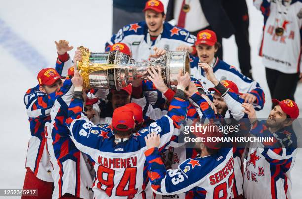 Moscow's players celebrate with the trophy as they celebrate their victory over Ak Bars Kazan after the Gagarin Cup 2023 final series game of the...