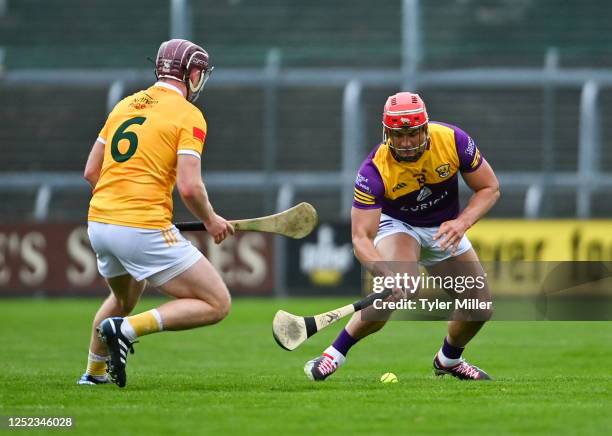 Wexford , Ireland - 29 April 2023; Lee Chin of Wexford in action against Eoghan Campbell of Antrim during the Leinster GAA Hurling Senior...