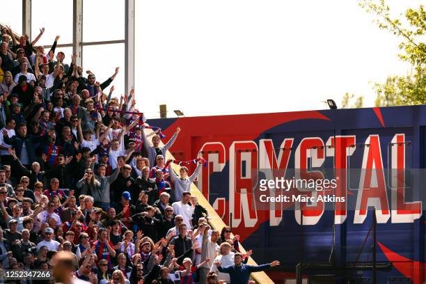 Crystal Palace fans sing during the Premier League match between Crystal Palace and West Ham United at Selhurst Park on April 29, 2023 in London,...