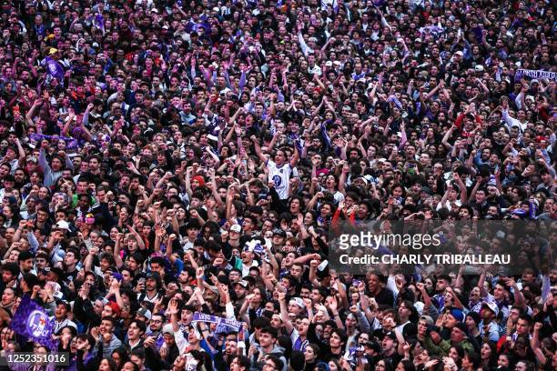 Toulouse's supporters cheer their team in a fan zone at Place du Capitole in Toulouse, southwestern France, on April 29 during the French cup final...