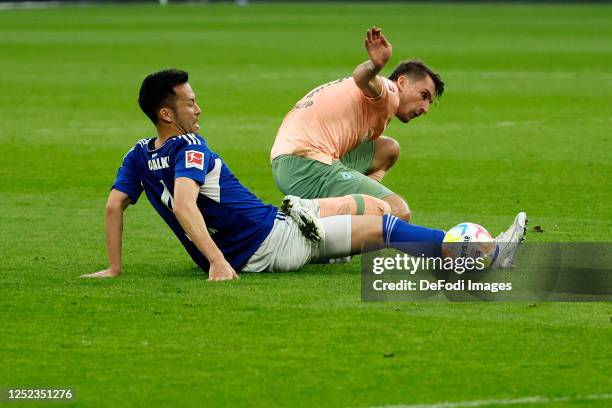 Maya Yoshida of FC Schalke 04 and Maximilian Philipp of SV Werder Bremen battle for the Ball during the Bundesliga match between FC Schalke 04 and SV...