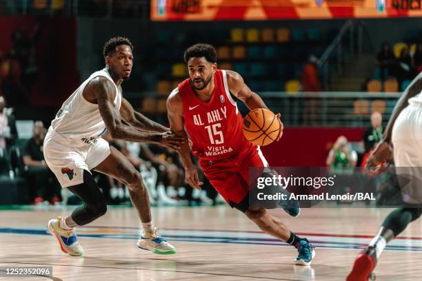 Corey Webster of the Al Ahly dribbles the ball during the game against The City Oilers on April 29, 2023 at the Dr Hassan Moustafa Sports Hall. NOTE...