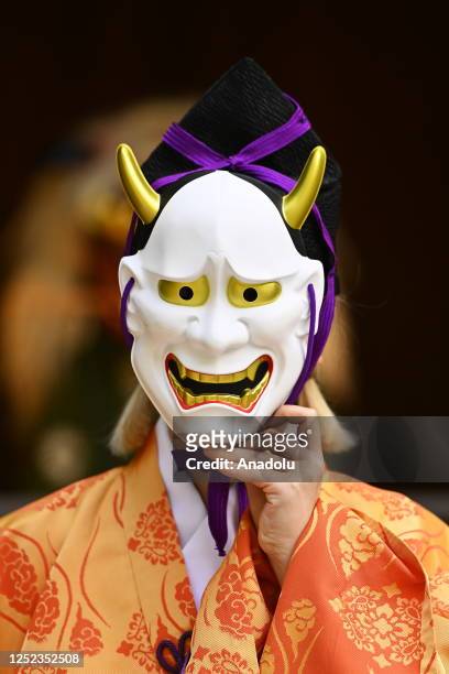Person wearing a evil mask to make cry babies poses on a ring during the Nakizumou event at Sanctuary Yukigaya Hachiman on April 29 in Tokyo, Japan....