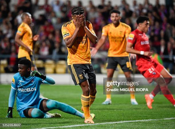 Benfica's Brazilian midfielder David Neres reacts after missing a goal during the Portuguese league football match between Gil Vicente FC and SL...