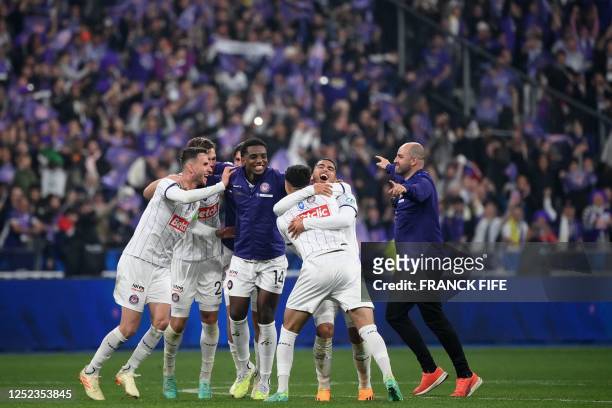 Toulouse's Cape Verdean defender Logan Costa celebrates with teammates winning the French Cup final football match between Nantes and Toulouse at the...