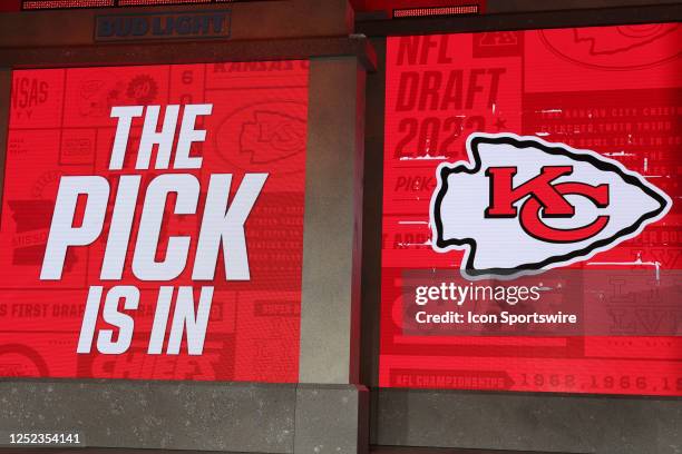 View of the Kansas City Chiefs logo as the screen reads "The Pick Is In" in the first round of the NFL Draft on April 27, 2023 at Union Station in...