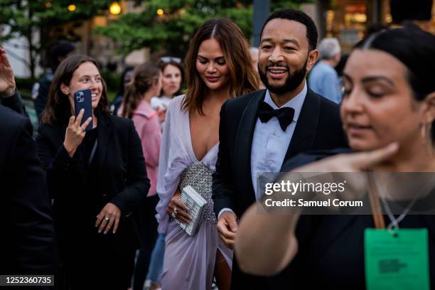 John Legend and his wife Chrissy Teigan arrive for the White House Correspondents' Dinner at the Washington Hilton on April 29, 2023 in Washington,...