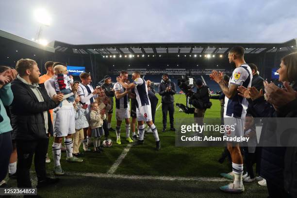 Jed Wallace of West Bromwich Albion embraces Jake Livermore of West Bromwich Albion as West Bromwich Albion players and staff form a guard of honour...