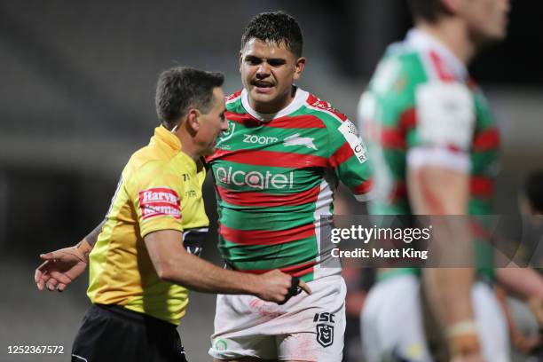 Latrell Mitchell of the Rabbitohs argues with referee Gerard Sutton after being sent to the sin bin during the round seven NRL match between the...