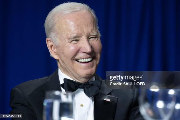 President Joe Biden laughs during the White House Correspondents' Association dinner at the Washington Hilton in Washington, DC, April 29, 2023.