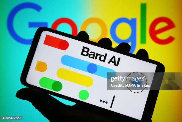 In this photo illustration, Google Bard AI logo is seen on a smartphone and Google logo on a pc screen.