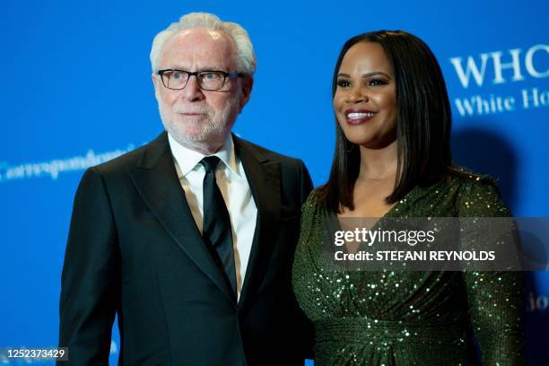 Journalist Wolf Blitzer and attorney Laura Coates arrive for the White House Correspondents' Association dinner at the Washington Hilton in...