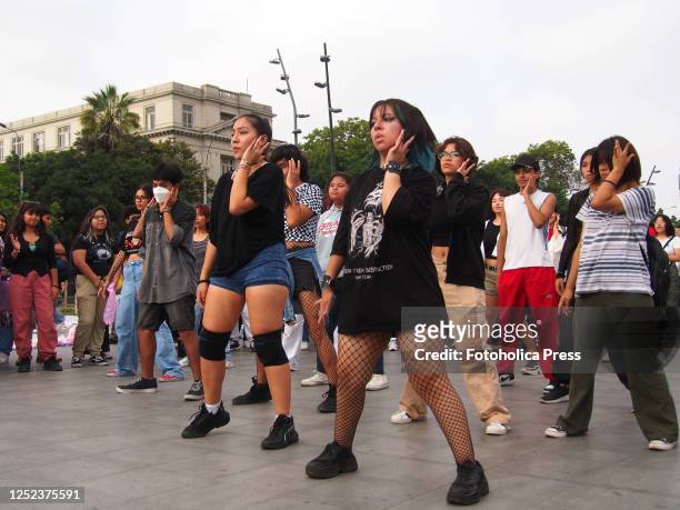 Followers of Korean Pop culture dance choreographies of their favorite groups in the streets of Lima downtown, as part of an spontaneous flash mob on...