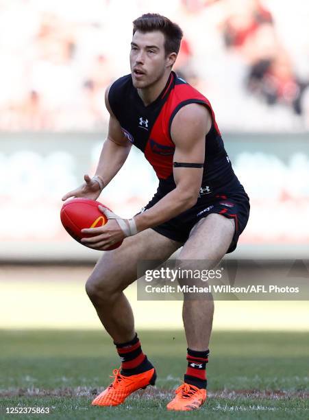 Zach Merrett of the Bombers in action during the 2023 AFL Round 07 match between the Essendon Bombers and the Geelong Cats at the Melbourne Cricket...