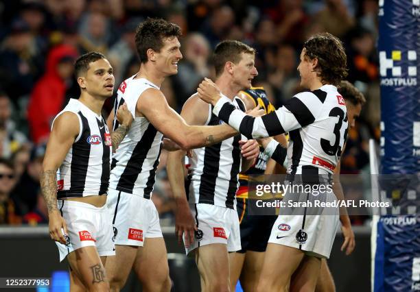 Brody Mihocek of the Magpies celebrates a goal with team mates during the 2023 AFL Round 07 match between the Adelaide Crows and the Collingwood...