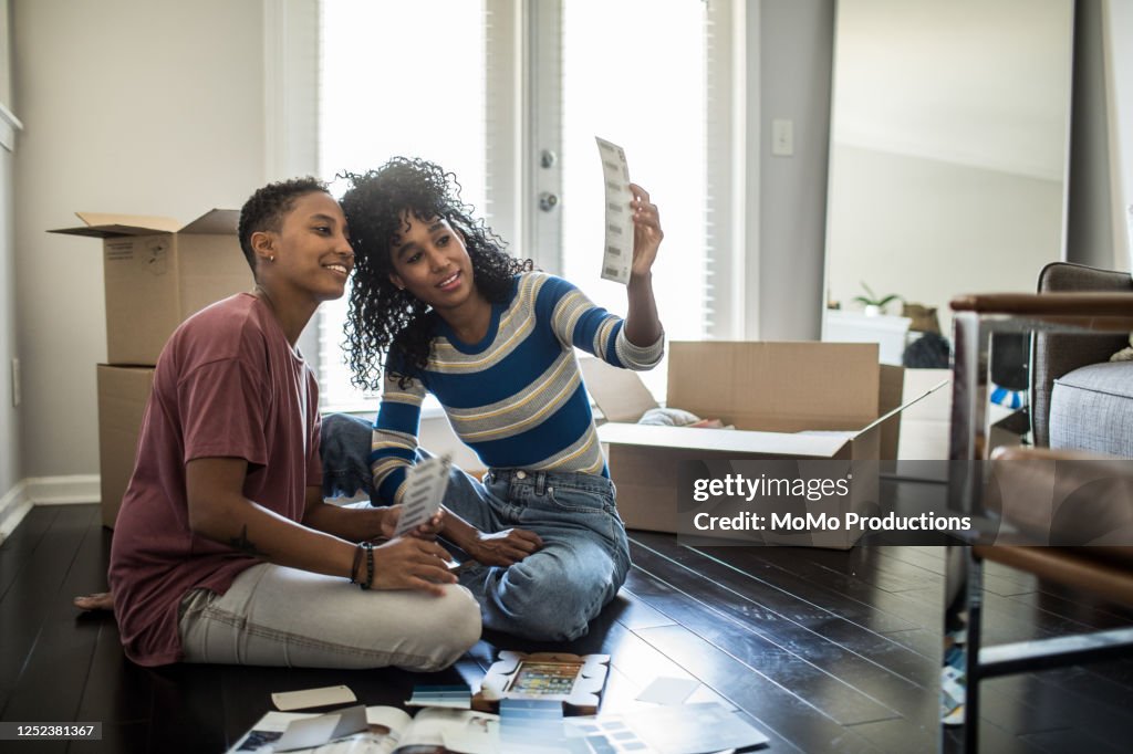 Lesbian couple picking paint colors for new home