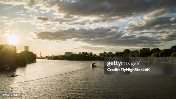 idyllic sunset over spree river, berlin, germany - treptower park stock pictures, royalty-free photos & images