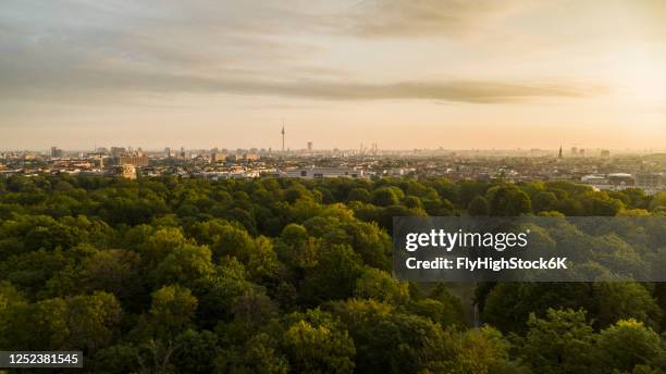 scenic sunset view volkspark friedrichshain park and berlin cityscape, germany - park berlin stock-fotos und bilder