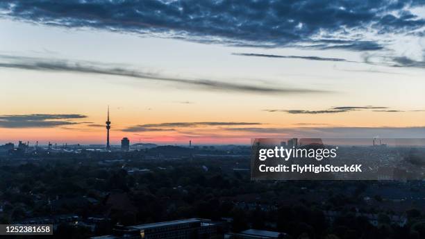 sunset sky over munich cityscape, bavaria, germany - silhouette münchen stock pictures, royalty-free photos & images