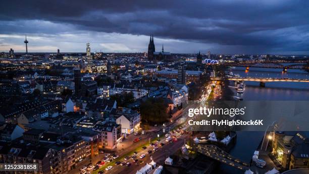 cologne cityscape illuminated at night, germany - cologne skyline stock pictures, royalty-free photos & images