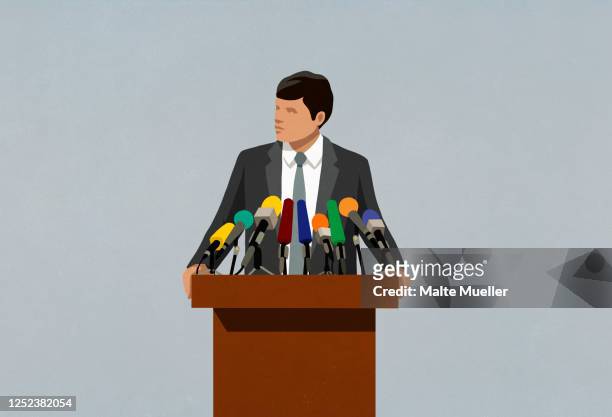illustrazioni stock, clip art, cartoni animati e icone di tendenza di politician speaking at microphones on podium - politica