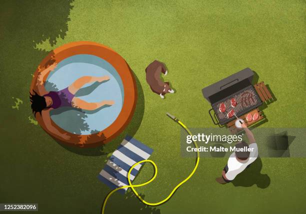 woman relaxing in kiddie pool while man barbecues in backyard - home exterior stock illustrations