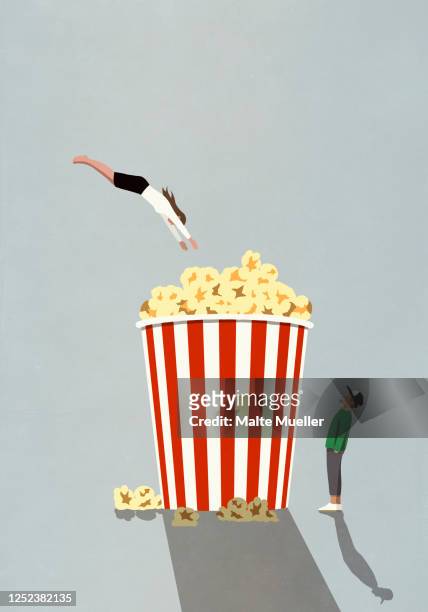 illustrations, cliparts, dessins animés et icônes de woman diving into large movie theater popcorn tub - jeunes garçons