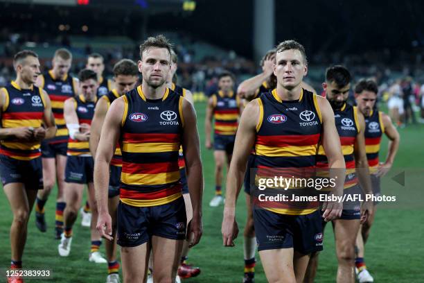 Brodie Smith and Jordan Dawson of the Crows after their loss during the 2023 AFL Round 07 match between the Adelaide Crows and the Collingwood...