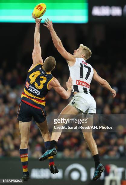 Reilly O'Brien of the Crows and Billy Frampton of the Magpies during the 2023 AFL Round 07 match between the Adelaide Crows and the Collingwood...