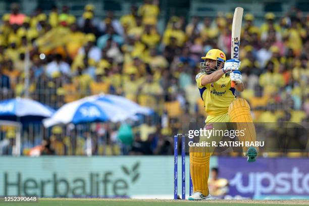 Chennai Super Kings' Mahendra Singh Dhoni watches the ball after playing a shot during the Indian Premier League Twenty20 cricket match between...