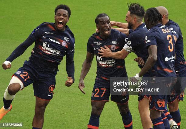 Montpellier's French defender Faitout Maouassa celebrates with teammates after he scored the second goal for his team during the French L1 football...