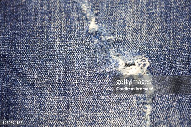 hole in jeans, ripped & torn jeans - ripped jeans bildbanksfoton och bilder