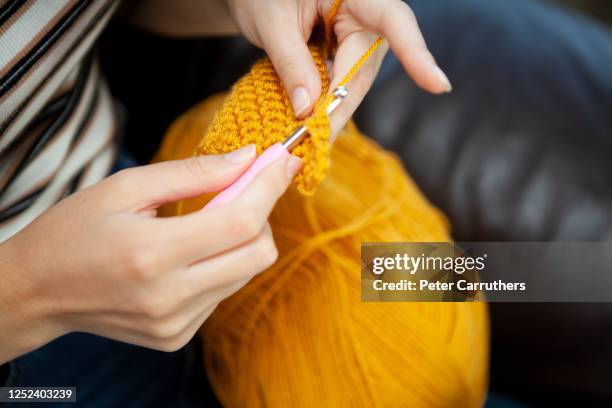 close-up of hands doing crochet - crochet stock pictures, royalty-free photos & images