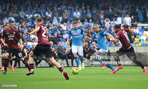 Napoli's Slovakian midfielder Stanislav Lobotka challenges Salernitana's Dutch midfielder Tonny Vilhena during the Italian Serie A football match...