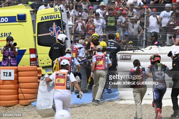 Rescuers tend to Yamaha French rider Fabio Quartararo and Aprilia Portuguese rider Miguel Oliveira after falling during the MotoGP Spanish Grand Prix...