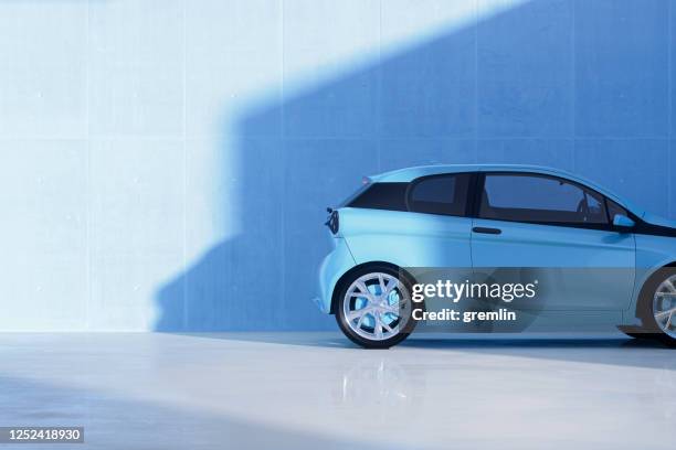 generic modern car against concrete wall - blue car stock pictures, royalty-free photos & images