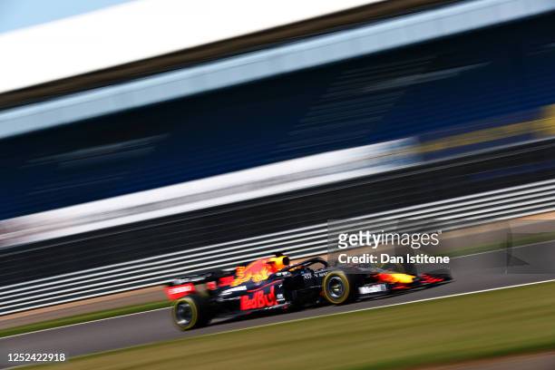 Alexander Albon of Thailand driving the Aston Martin Red Bull Racing RB16 on track during the Red Bull Racing RB16 Filming Day at Silverstone Circuit...