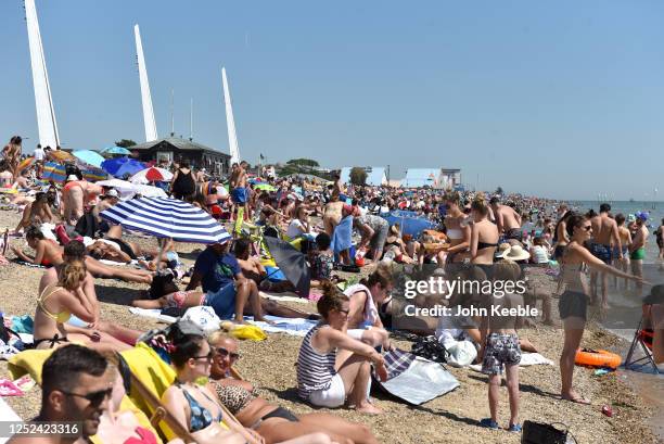 General view of as crowds of people gather on the beach on June 25, 2020 in Southend-on-Sea, England. The UK is experiencing a summer heatwave, with...