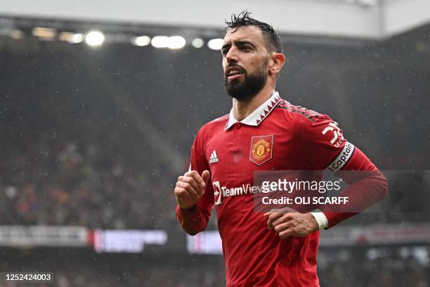 Manchester United's Portuguese midfielder Bruno Fernandes celebrates after scoring his team first goal during the English Premier League football...