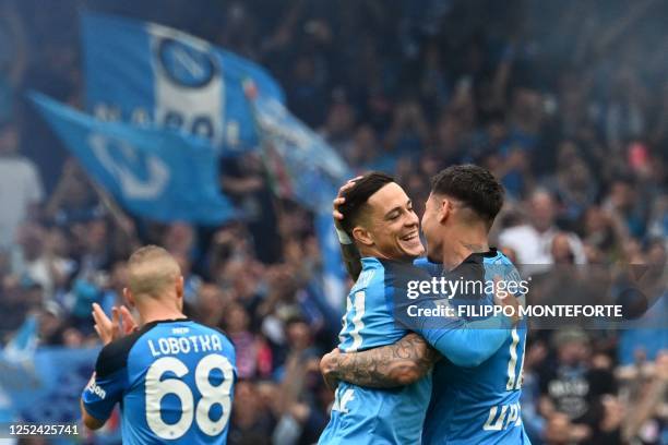 Napoli's Italian forward Giacomo Raspadori congratulates Napoli's Uruguayan defender Mathias Olivera after Olivera opened the scoring during the...