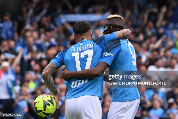 Napoli's Nigerian forward Victor Osimhen congratulates Napoli's Uruguayan defender Mathias Olivera after Olivera opened the scoring during the...