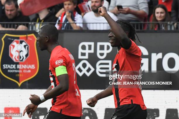 Rennes' Belgian forward Jeremy Doku celebrates scoring his team's third goal during the French L1 football match between Stade Rennais FC and SCO...