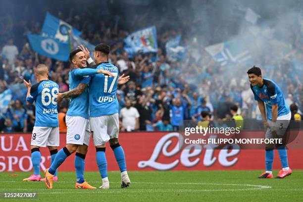 Napoli's Italian forward Giacomo Raspadori congratulates Napoli's Uruguayan defender Mathias Olivera after Olivera opened the scoring during the...